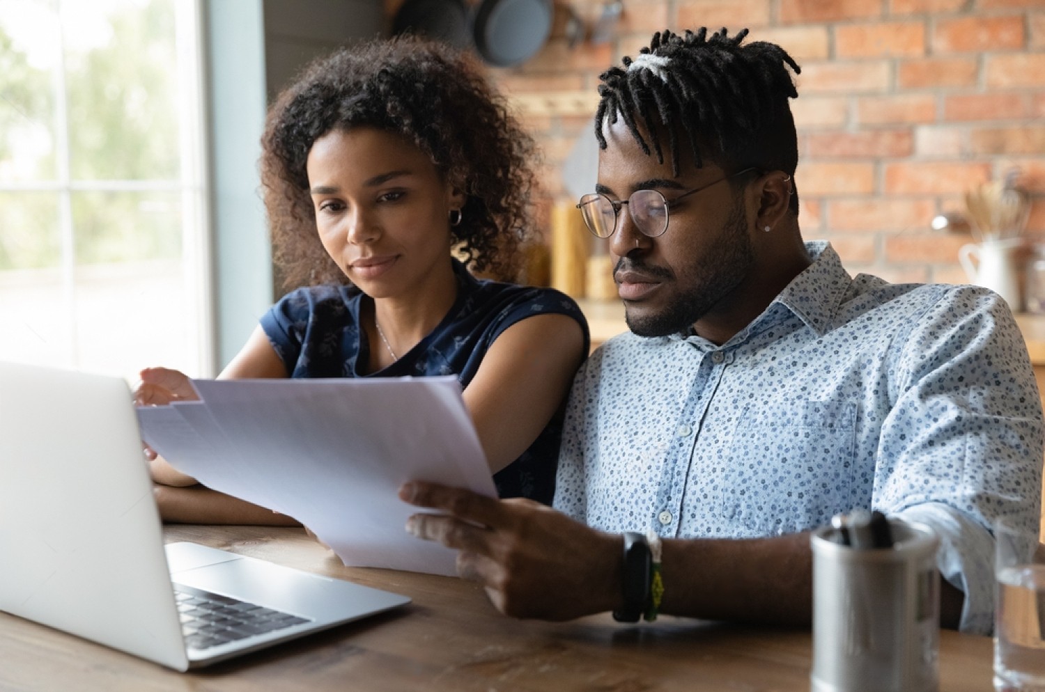 stock photo serious millennial black married couple reading documents at laptop together checking monthly 2029044401 transformed